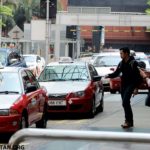 Passengers getting taxi from a designated stand