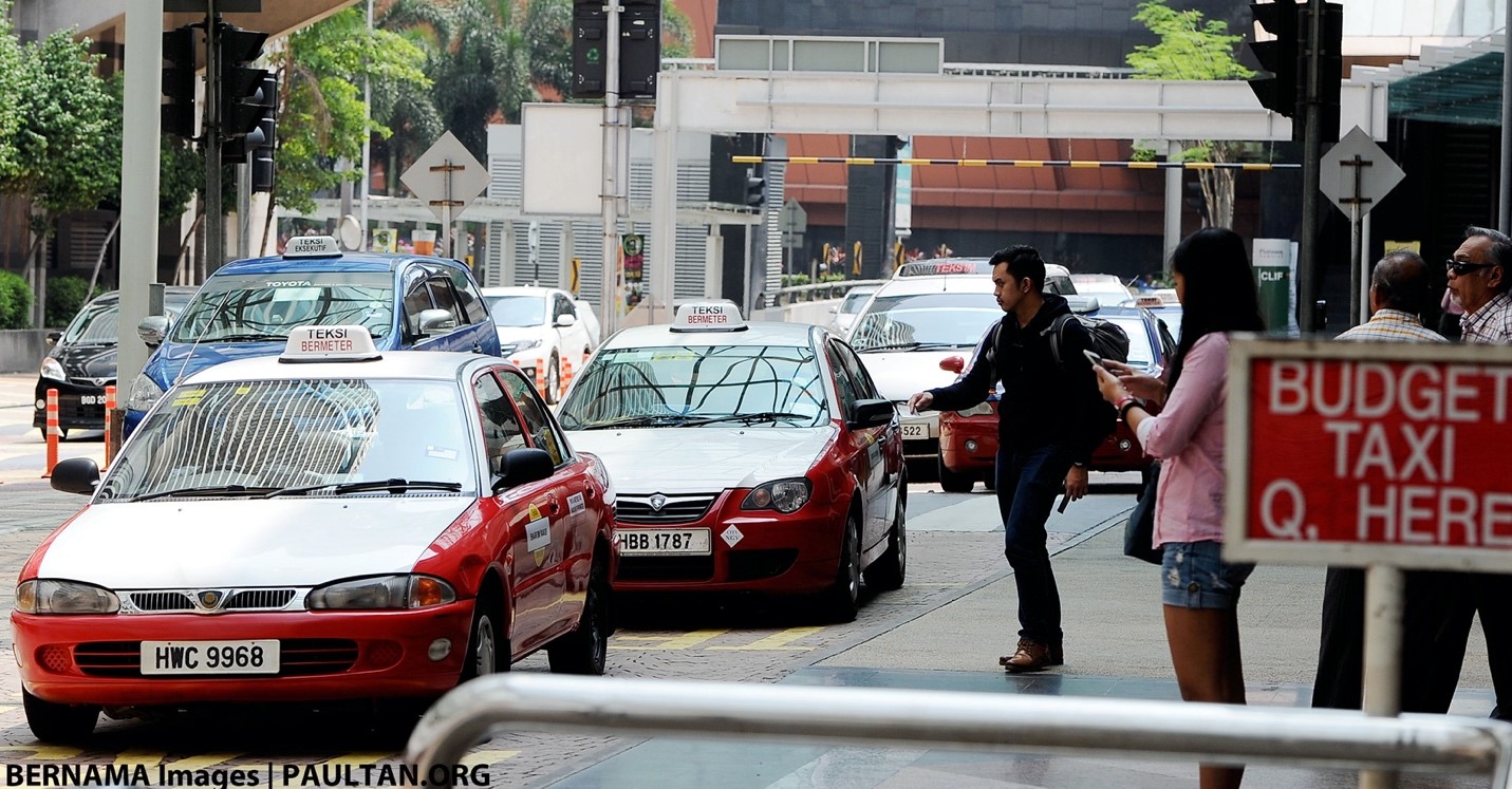 Passengers getting taxi from a designated stand